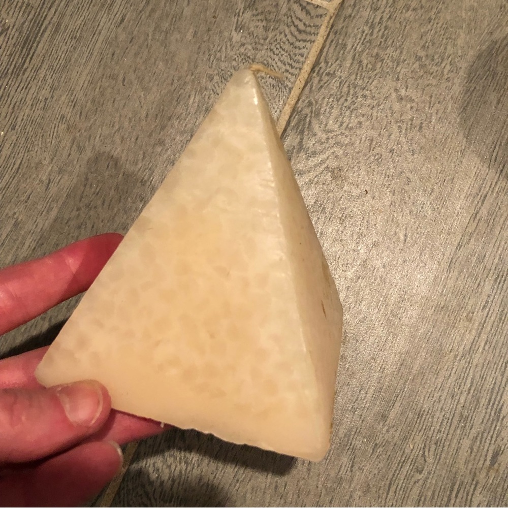 Tan pyramid shaped candle